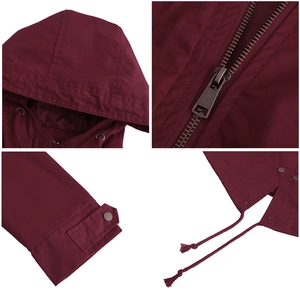 Detail view of wine red cotton parka showing hood drawstrings, metal zipper and sleeve cuffs