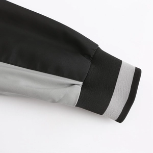 Close-up of black and grey contrast ribbed cuffs on lightweight hooded windbreaker