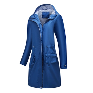 Detail of waterproof navy trench coat with blue striped lining and adjustable waist drawstring