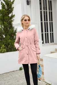 Detail view of pink parka with white faux fur collar and drawstring waist on model