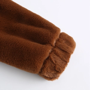 Detailed close-up of thick brown plush faux fur sleeve cuffs with warm elastic wrist design