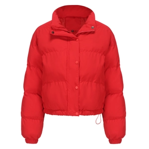 Detail of red padded jacket featuring stand-up collar and elasticized hem with size label