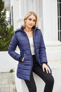 Close-up of water-resistant navy blue quilted parka with windproof ribbed cuffs and hood