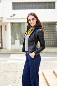 Close-up of black slim-fit leather jacket with silver zipper detail and mandarin collar