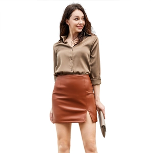 Brown satin long sleeve blouse paired with caramel slit PU leather mini skirt