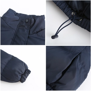Detail view of dark blue puffer jacket featuring stand collar with snaps and drawstring