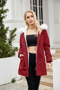 Detail of red parka with plush white faux fur collar and warm fleece lining