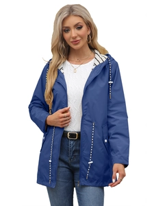 Detail view of water-resistant navy trench coat featuring striped hood lining and drawstrings