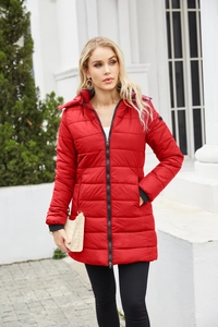 Detail of red water-resistant parka featuring horizontal quilting and black windproof cuffs