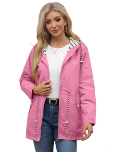 Close-up of pink waterproof raincoat jacket featuring adjustable drawstrings and striped lining