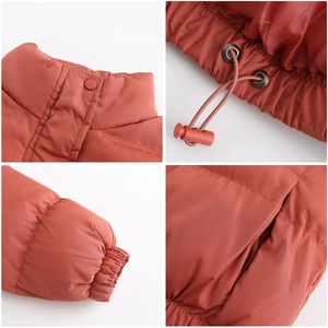 Detail view showing stand collar, elastic cuffs and adjustable drawstring on winter coat