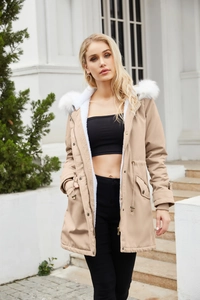 Close-up of khaki parka with detachable white faux fur collar and warm fleece lining
