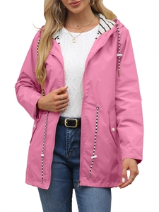 Detail of pink hooded raincoat showing striped lining and drawstring waist for women