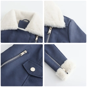 Détails d'une veste en similicuir bleu avec col en fausse fourrure blanche et zips argentés