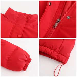 Detail view of red winter jacket showing stand-up collar, snap buttons and zipper