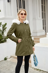 Detail of army green hooded parka with plush white faux fur collar and drawstring waist