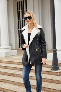 Detail of faux leather jacket with plush shearling collar and waist belt buckle
