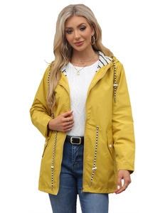Detail of yellow waterproof raincoat featuring striped hood lining and adjustable drawstrings