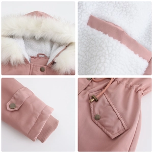Detail view of pink parka showing white faux fur lining, bronze snaps and drawstring waist