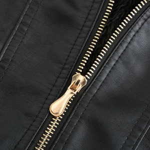 Close-up of black leather jacket with gold zipper, double stitching and plush lining