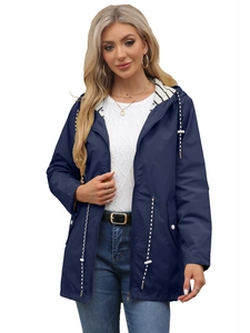 Detail of navy hooded raincoat featuring striped lining and white drawstrings on the hood