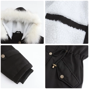 Detail view of black parka coat with white faux fur hood and warm fleece lining