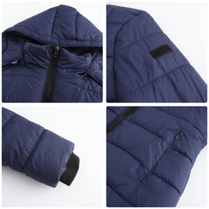 Detail view of navy blue hooded parka with zipper pockets and elastic cuffs