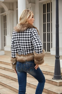 Detail of houndstooth jacket featuring luxurious faux fur trim and classic slim fit cut