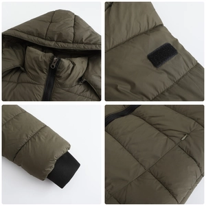 Detail view showing ribbed cuffs, quilted texture, and hooded collar of the green parka