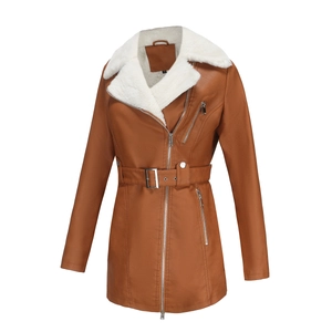 Detail view of brown PU leather coat featuring plush faux lamb wool lining and belt