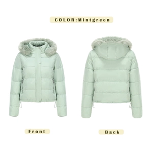 Detail view of mint green hooded jacket with faux fur trim and quilted texture