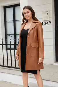 Detail view of brown PU leather trench coat with classic lapels and flap pocket