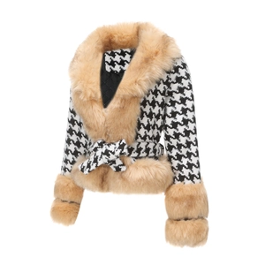 Detail of the houndstooth jacket featuring faux fur collar and quilted lining texture