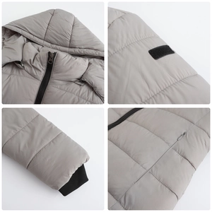 Detail view of water-resistant gray padded jacket with hood, zipper, and ribbed windproof cuffs