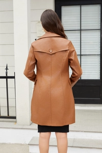 Rear view of long faux leather coat for women in brown with back button detail