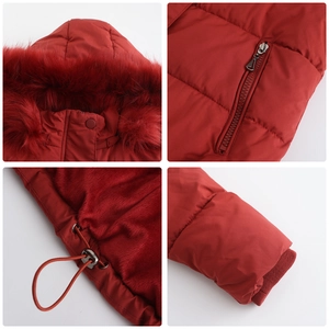 Detail view of red winter jacket featuring faux fur collar and adjustable waist drawstrings