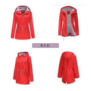 Detail view of red waterproof raincoat featuring striped lining and drawstring waist