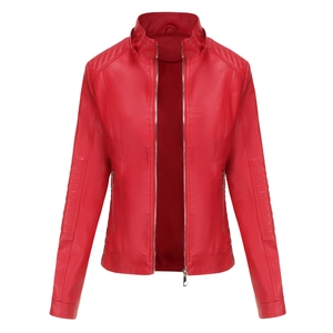 Detail of red faux leather jacket featuring quilted shoulder stitching and zip pockets