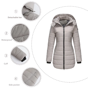 Detail view of detachable hood, waterproof fabric, ribbed cuffs and side pockets on jacket