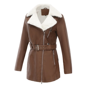 Detail of faux leather jacket with plush white fleece lining and metal buckle belt