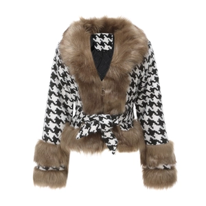 Detailed view of women houndstooth jacket with brown faux fur trim and quilted lining