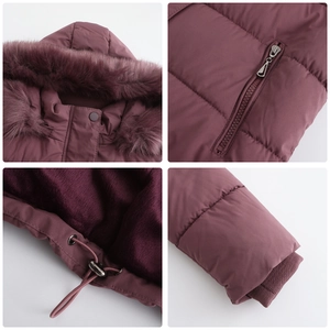Detail view of winter jacket featuring fur hood, zip pockets, and adjustable drawstring