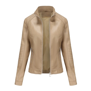 Detailed view of women's beige faux leather jacket with quilted shoulder and metallic zipper