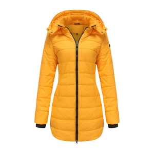 Detail of yellow quilted parka with contrast black zipper and ribbed windproof cuffs