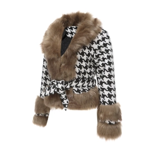 Detail of houndstooth jacket featuring luxury faux fur trim and quilted inner lining