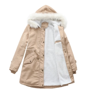 Detail of hooded parka featuring plush faux fur collar and warm fleece lining