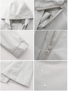 Detail view of water-resistant windbreaker featuring adjustable hood and velcro cuffs