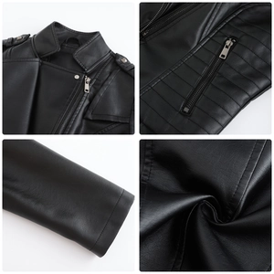 Detail view of black faux leather biker jacket featuring stud accents and metal zippers
