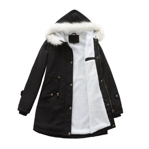 Detail of hooded parka featuring warm white fleece lining and thick faux fur trim collar