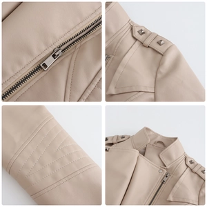 Detail view of apricot faux leather jacket showing metallic rivets and premium zipper